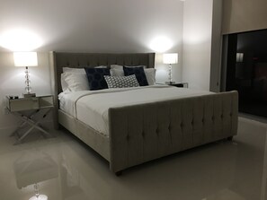 Master bedroom with king bed and dresser