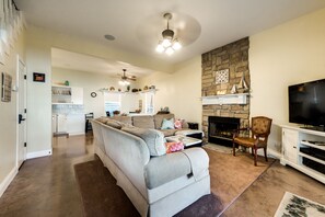 Comfortable living room with wood fireplace and flat screen TV