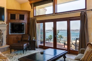 The relaxing view from this living room overlooks scenic Newport Harbor with view all the way out to Catalina Island.