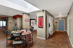 Looking back to the front door and den.