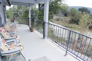 The best seat in the valley - overlooking the Frio River from the front porch