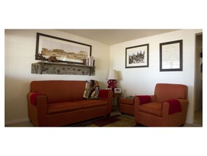 Enjoy our cozy living room.  The loveseat makes into a bed for one adult.
