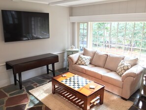 Living Room area with 65in UHDTV/DVD/Cable and accessory fold-out dining table