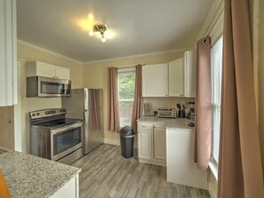 Newly renovated, fully stocked kitchen with granite counters