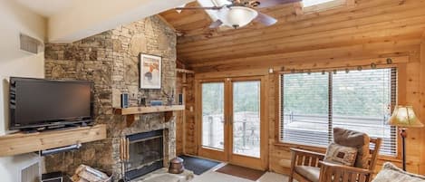 Living Room with Wood Burning Fireplace leading