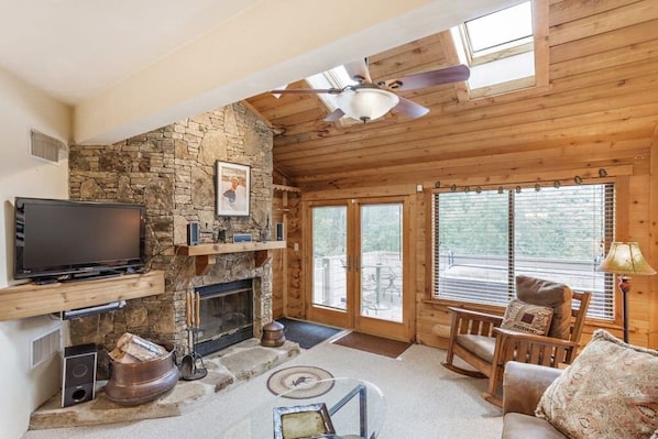 Living Room with Wood Burning Fireplace leading