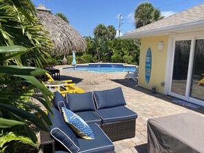 Spacious tropical backyard with lots of room, very private with salt water pool.