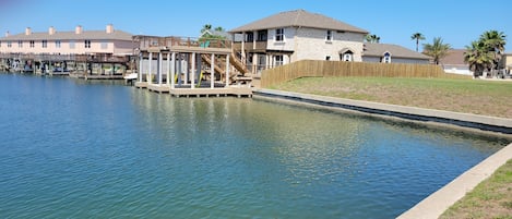 Roomy duplex with large dock, 2 boat lifts, and upper decks!