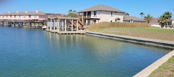 Roomy duplex with large dock, 2 boat lifts, and upper decks!