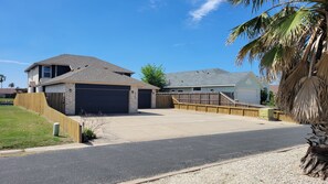 Spacious driveway for vehicles and boat trailers!