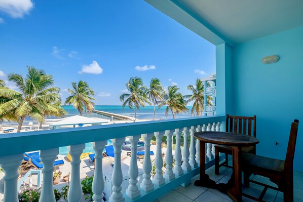 Balcony on each level overlooking the pool with the sea beyond