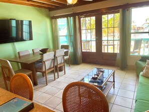 Dining/iving area (with queen sleeper sofa) & view to balcony