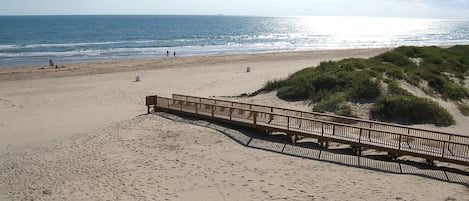 To get to the beach - go down to 1st floor, exit building & take this beach walk