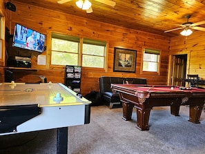 Game Room: Pool table, air hockey, arcade, tv, game system, futon, twin sleeper