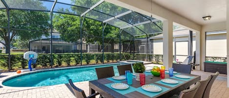 The lanai has a table that seats 8, privacy bushes, 4 lounge chairs & BBQ