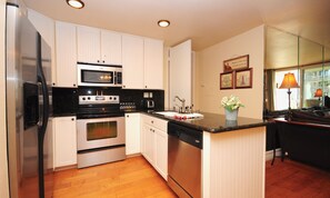 Gourmet kitchen with stainless steel appliances and all your necessities to cook