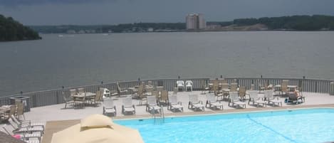 Our beautiful outdoor pool sitting on a point and overlooking  the lake.