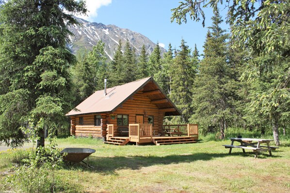 View of the outside of the log cabin.