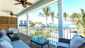 Eat, Celebrate or just Relax and enjoy the view!  Upper deck Lounge area view overlooking the beach and dock area