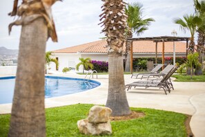 Relax on the lounge chairs next to the pool!