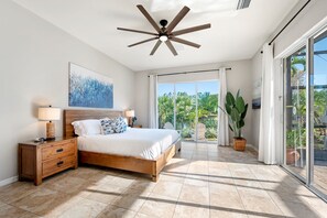 Wake up to water views in this bright and breezy primary suite