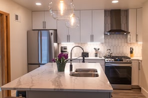 Brand new kitchen with double sink and huge prep island