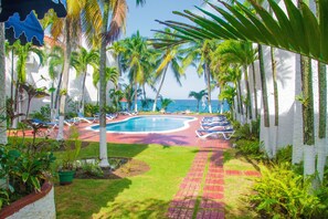 Steps away from our luscious garden, pool and ocean