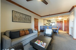 Living room, dinning table and kitchen