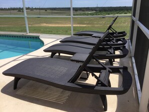 4 loungers to relax - enjoy the view and get some sun. Small drinks tables!