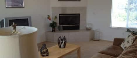 Spacious and comfortable living room with gas fireplace