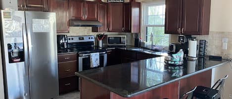 Exclusive, full kitchen with all appliances and granite countertops