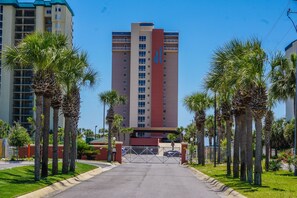 Destin Towers Driveway Entrance with Security Gate. Covered Garage in Front.
