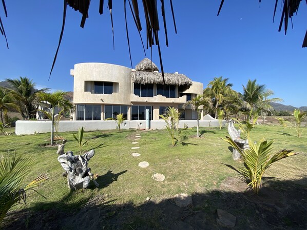 Castillo de Arena from the private beach front palapa and hammocks.