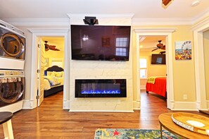 65 inch TV with a cozy fire place