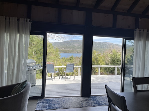 Huge double sliding doors to deck and views of the ocean and mountains