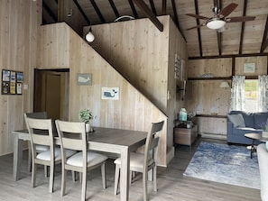 Dining area with stairs to sleeping loft and master