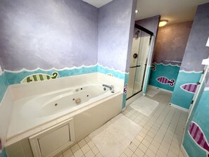 Master bathroom with jetted jacuzzi tub and shower