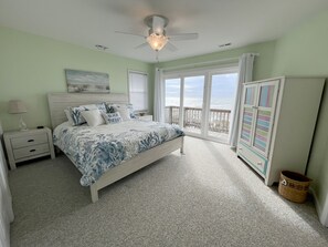 Master featuring a king bed with oceanfront views, private balcony & ensuite