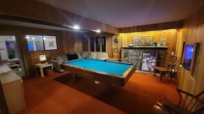 Pool Table Room with Hot Tub room in background.   Mount Snow House Rental.