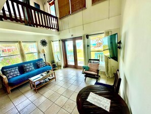 Living/dining area; double doors to front porch