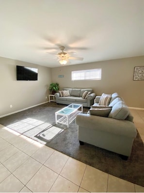 Queen Sleeper sofa and Firestick TV in living room