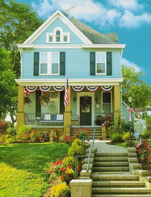 Front Porch of The Good Ol' Days House on a Summer Day