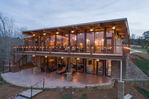 Two levels of floor to ceiling glass perched above Lewis Smith Lake.