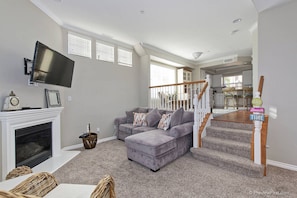 Living room has TV and fireplace