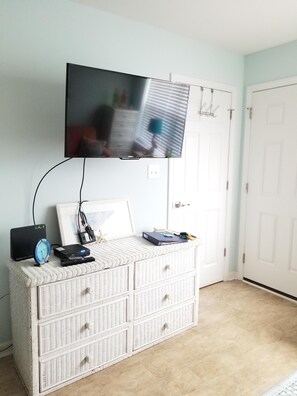 Nice flat screen tv  and storage for your clothes.