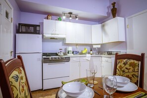 Above the refrigerator and freezer sits the microwave. 