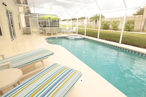 Pool and Spa with loungers and comfy seating