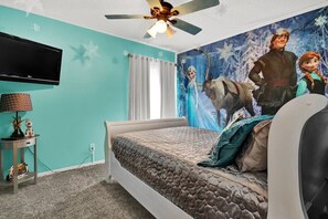 ❄️ "For the ultimate Frozen fan, our Frozen-themed bedroom is a winter wonderland year-round. Sleep surrounded by Elsa and Anna's enchanting world, and let the magic of Arendelle fill your dreams. Make your stay a frosty fantasy – book now!"