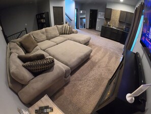 14 foot wide couch with 65 inch tv and fireplace.