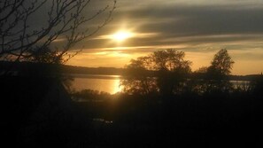 The view off the deck with the sun going down.